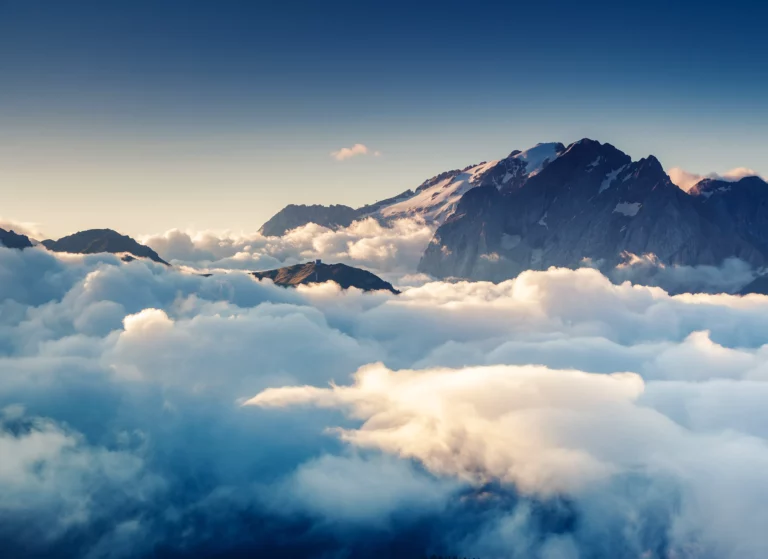 colorful clouds at the foot of snowy mountain