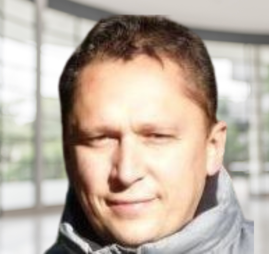 man's headshot on corporate background